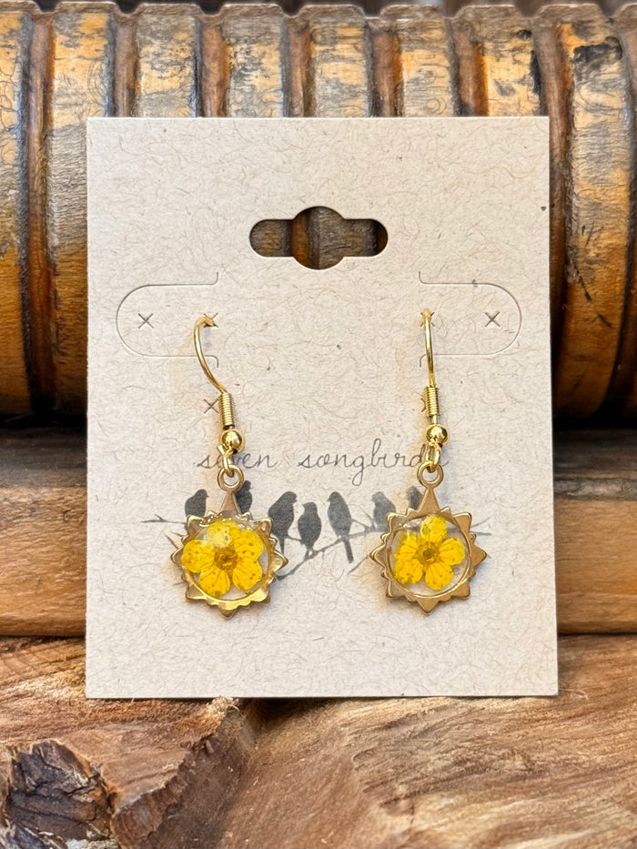 Gold-tone fishhook earrings with yellow flower charms and small chain dangles
