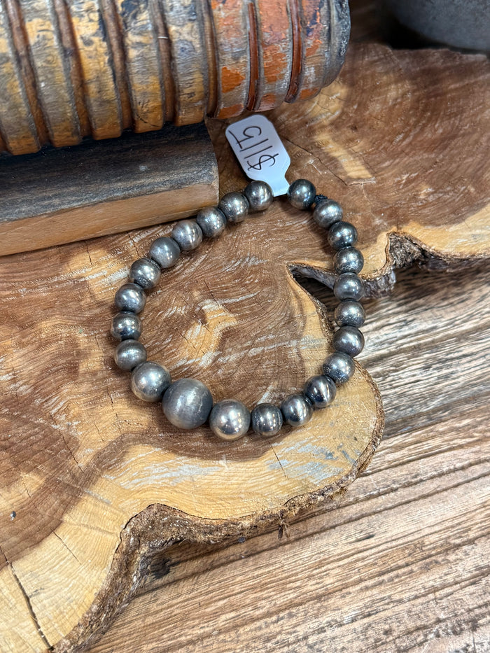 Sterling stretch bead bracelet with gray metallic beads and center round bead