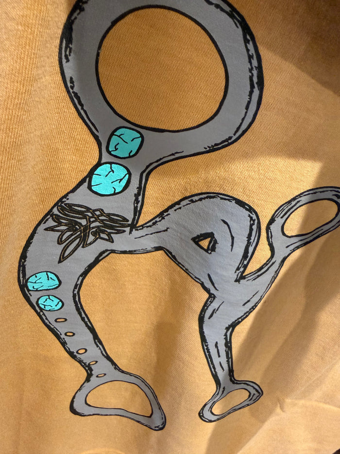 Mustard graphic t-shirt with cartoon animal illustration in gray and turquoise