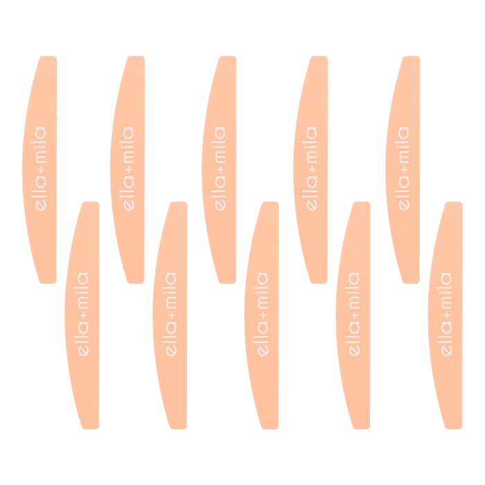 Ten peach half-moon nail files arranged in rows