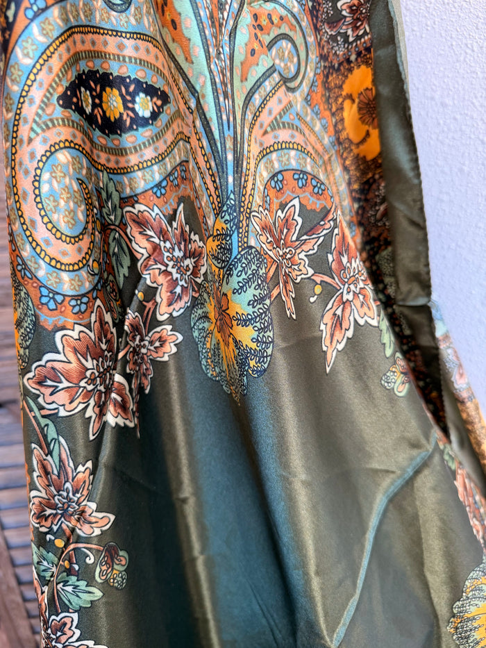 Multicolor paisley wild rag scarf with teal, orange, and dark green accents