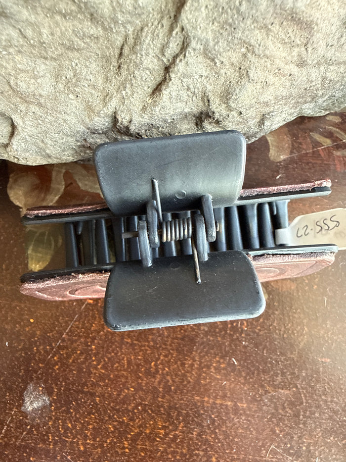 Leather hair claw with metal comb teeth and rectangular snaffle-bit style clips