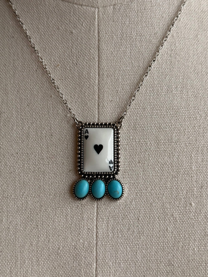 Rectangular ace pendant on silver chain with black heart detail and turquoise beads