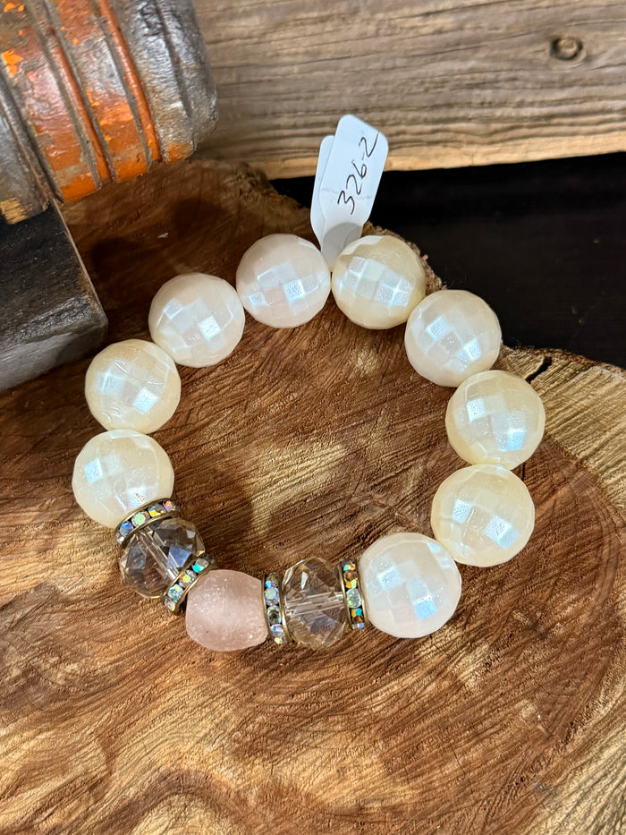Round opal-like bead stretch bracelet with rose quartz center charm and crystal spacers