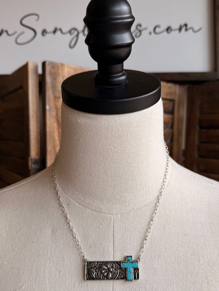 Turquoise cross bar pendant necklace with silver-tone frame and chain
