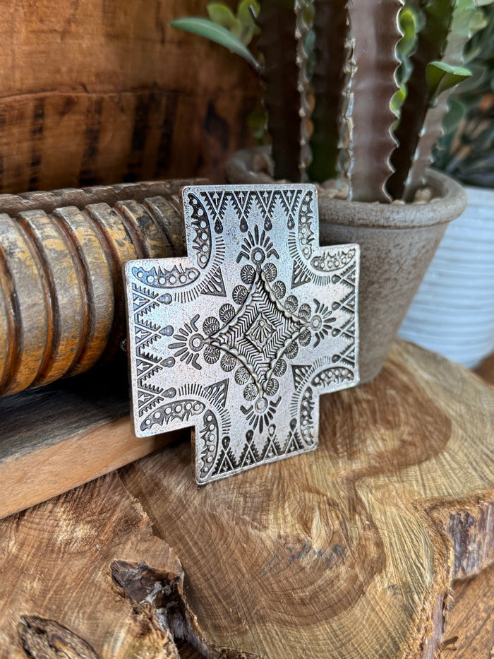 Cross belt buckle with silver engraved cross design and decorative linework