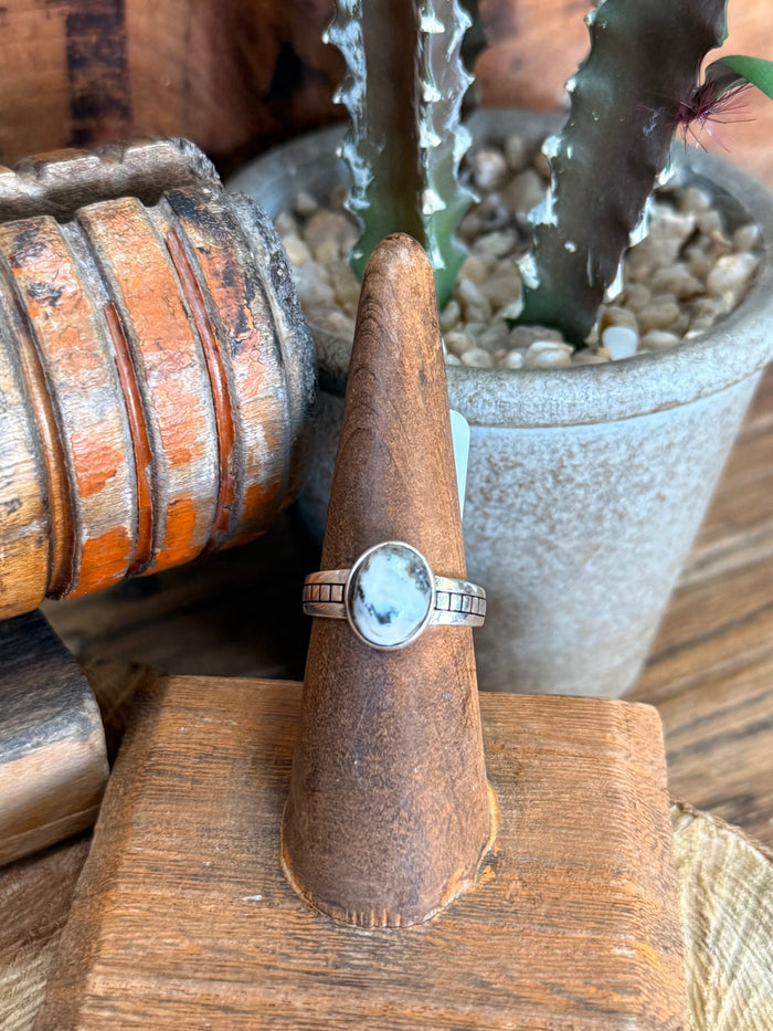 Sterling silver ring with round light blue cabochon and thin band