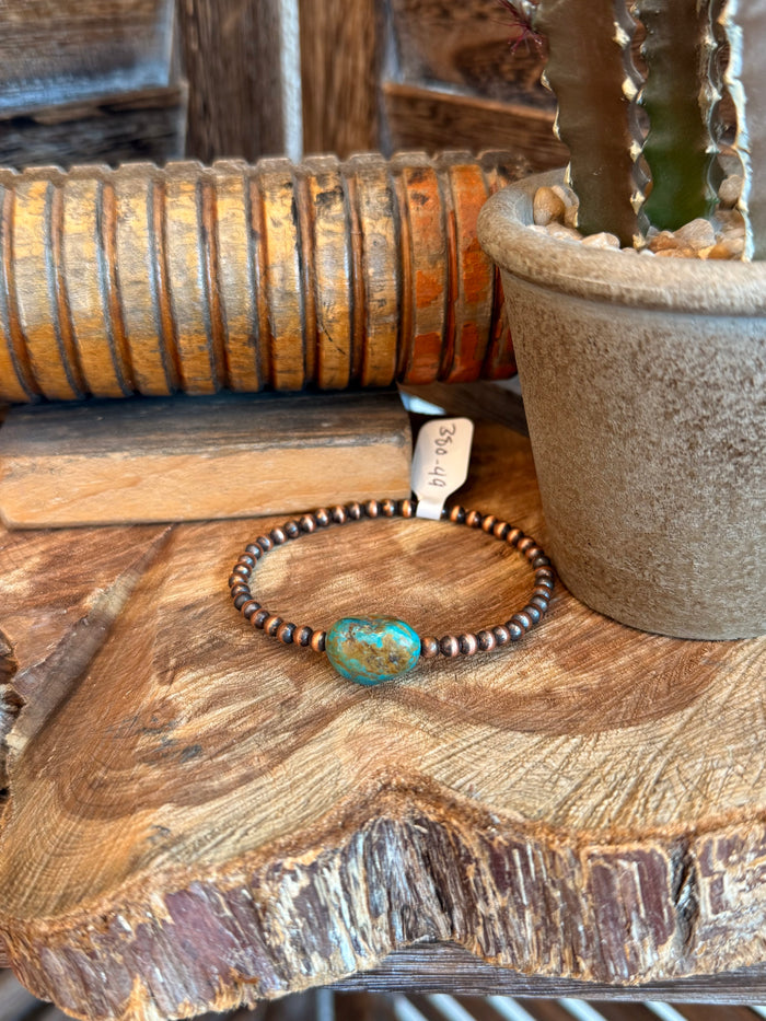 Copper stretch bracelet with small bead strand and turquoise oval centerpiece