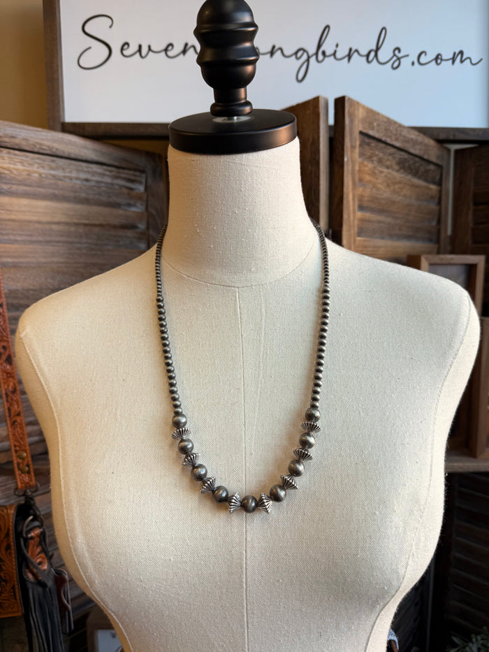 Silver pearl rondelle necklace, smooth graduated bead pattern on mannequin