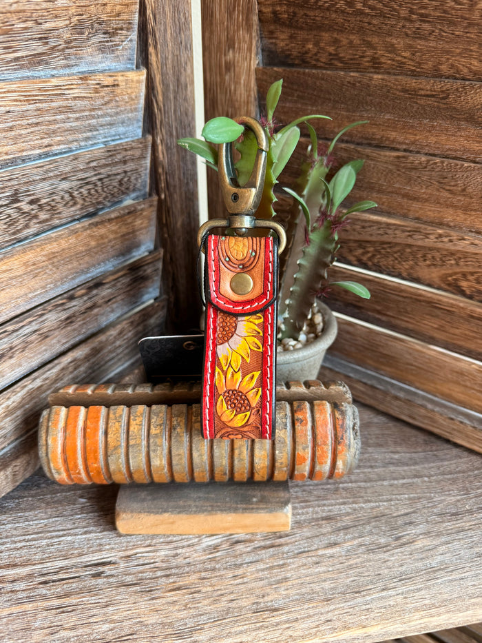 Tooled leather sunflower keychain with bronze key ring and red patterned strap
