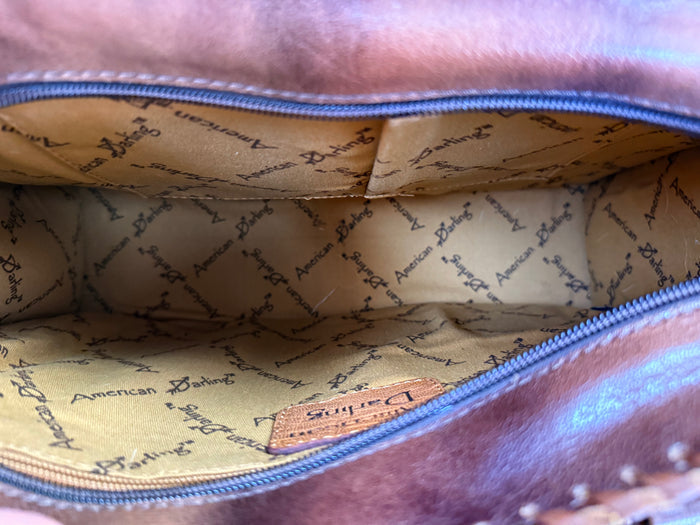 Cowhide briefcase tote interior lining with zipper pocket and patterned branding