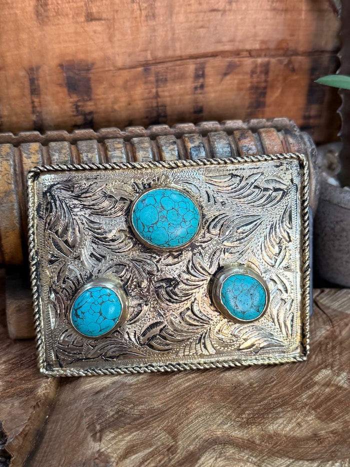Rectangular engraved belt buckle with three turquoise inlay stones, silver-tone border