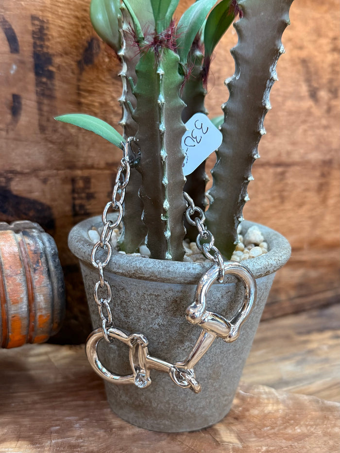 Silver snaffle bit bracelet, large D-ring bit detail on curb chain