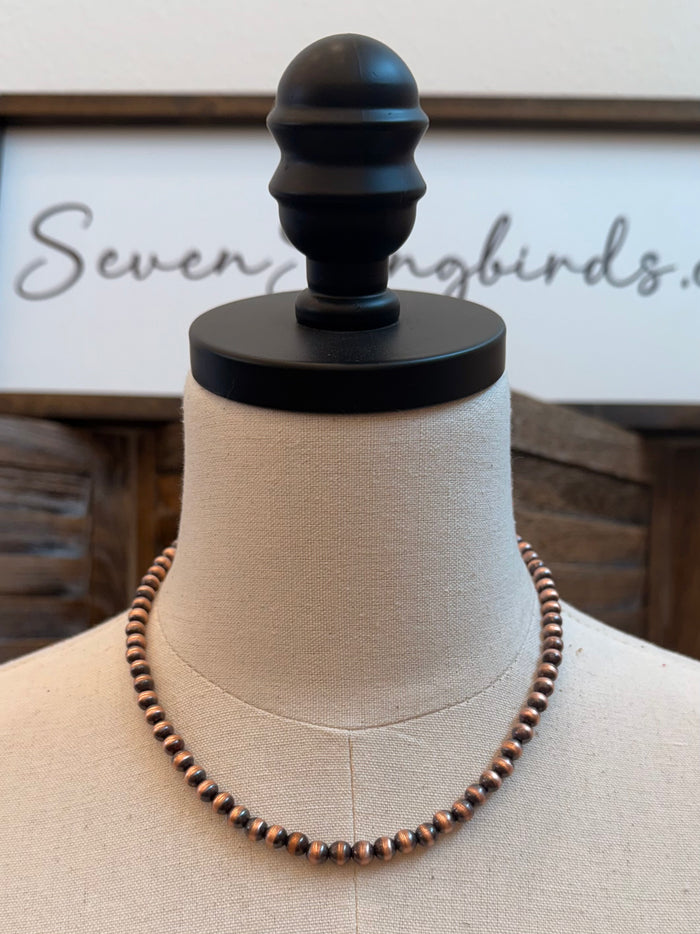 18 in genuine copper bead necklace with 6mm round beads on a mannequin