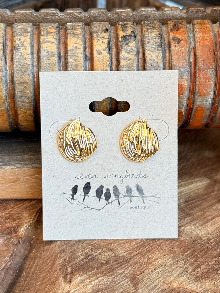 Gold-tone textured round stud earrings with ridged leaf-like design on card