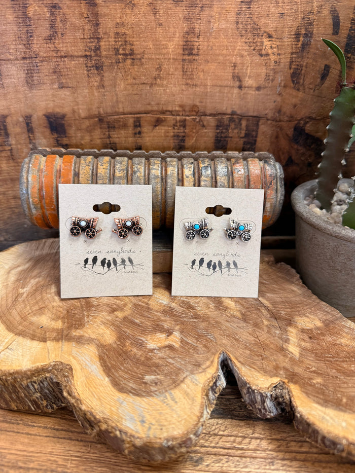Wagon stud earrings on card: dark round motif studs with tiny turquoise accents