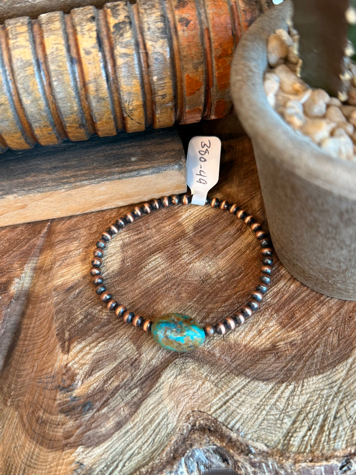 Copper stretchy bead bracelet with turquoise oval stone and bead band detail