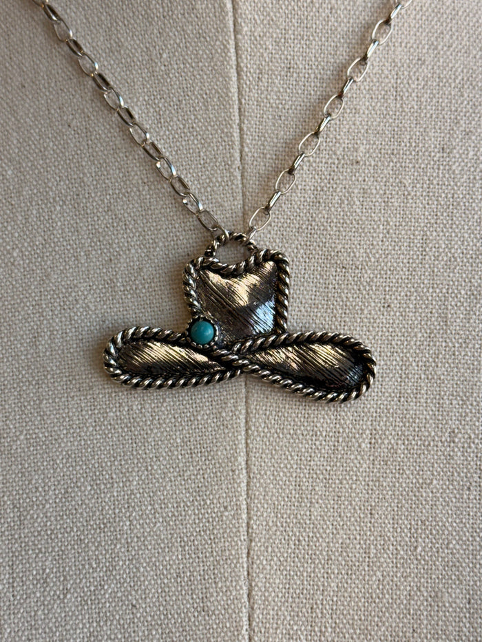 Silver cowboy hat rope pendant with turquoise accent on fine chain