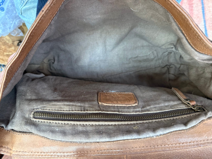 Chocolate leather crossbody purse interior lining with zipper pocket and leather tab