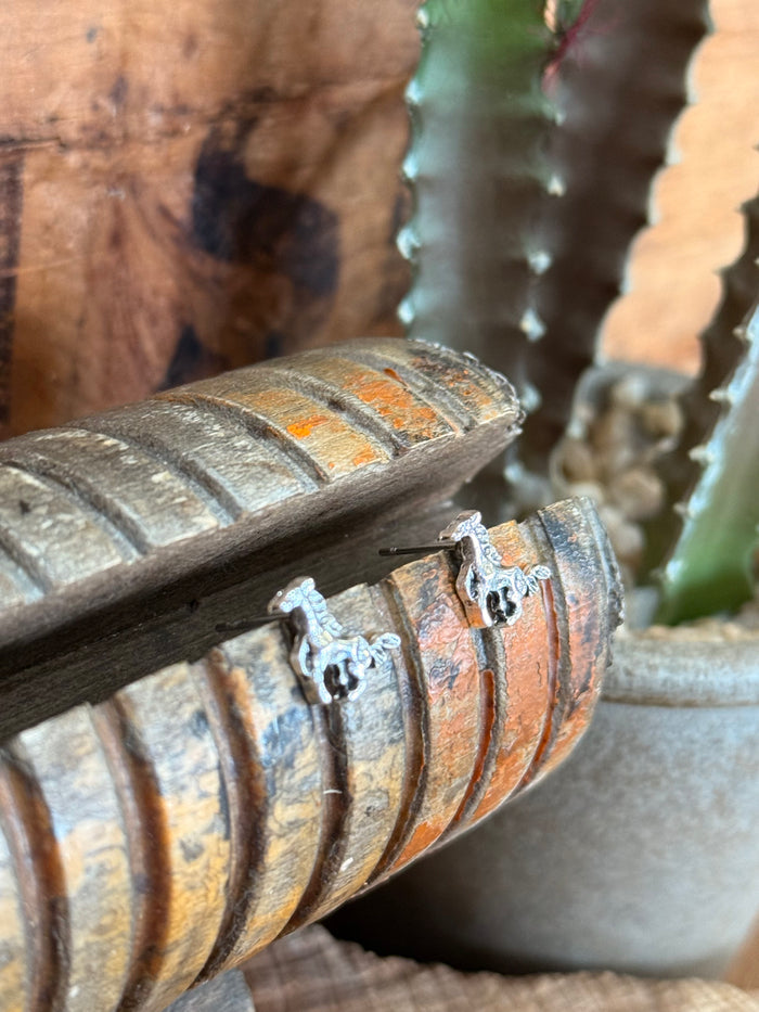 Silver running horse stud earrings, close-up of the horse-on-stud design