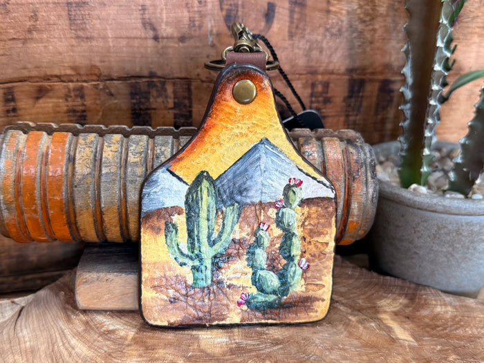Handpainted cactus leather key fob, blue mountain cacti scene with yellow border