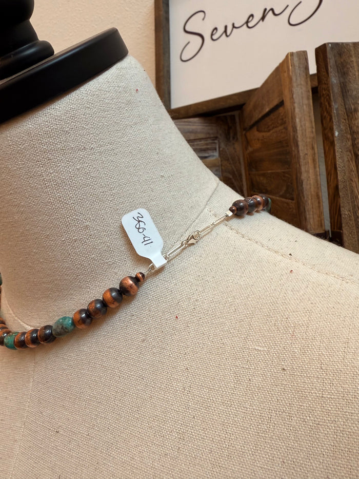 Copper and turquoise bead necklace clasp with lobster hook on mannequin