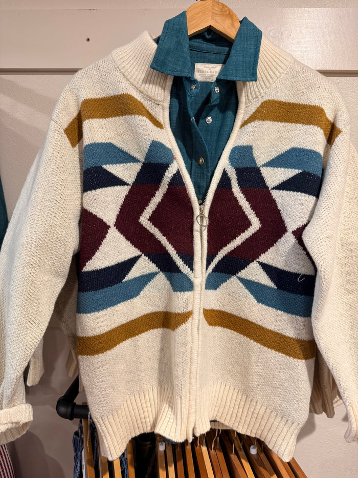 Cream aztec zip-front cardigan sweater with buttoned collar and geometric zigzag bands
