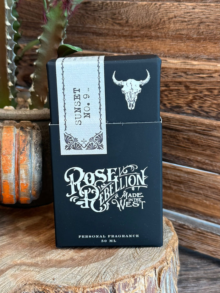 Dark blue personal fragrance perfume box front with bull head and ornate lettering