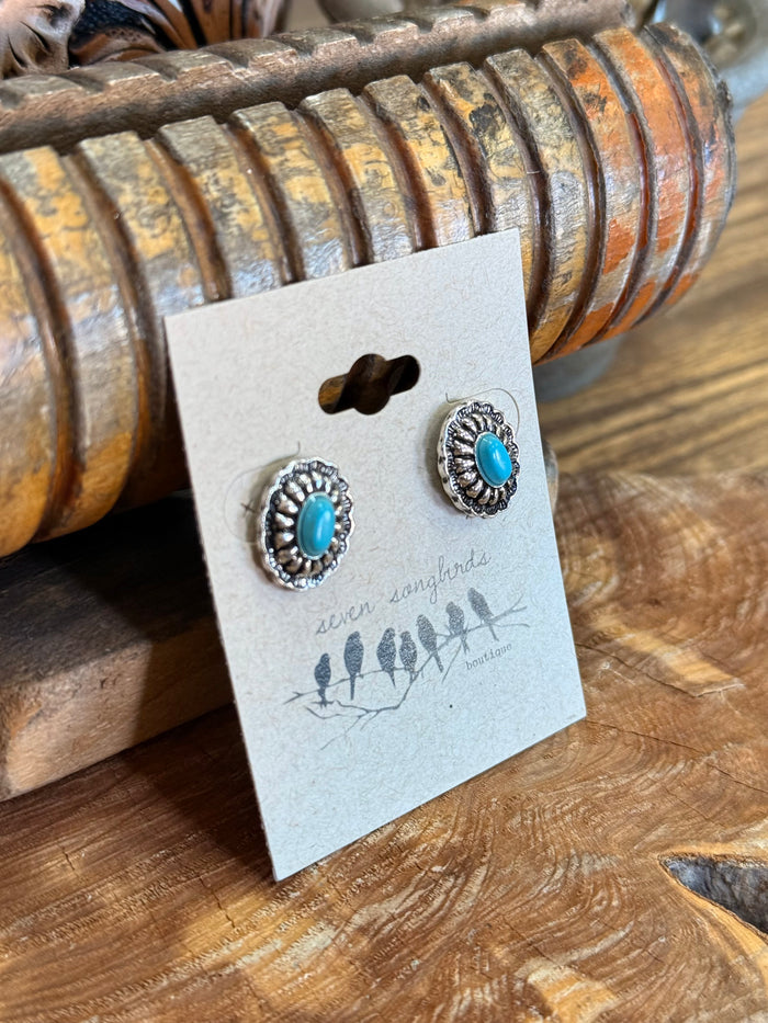 Silver concho stud earrings with turquoise oval center and rope-like edge