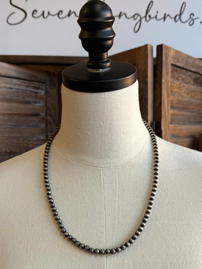 Silver-tone 21-inch beaded necklace with 6mm round beads, front view