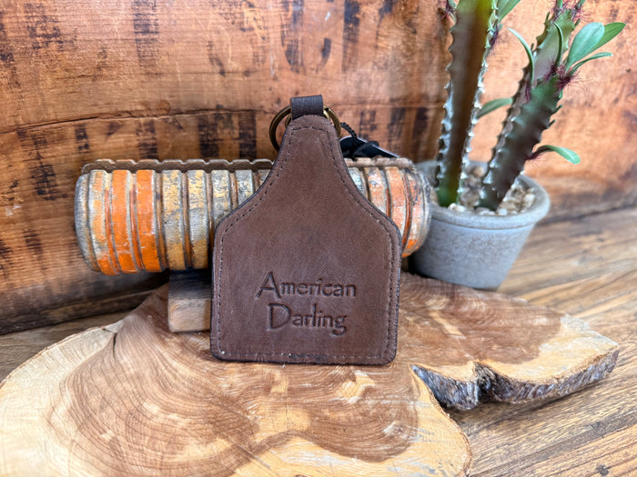 Hair-on key fob with brown leather-look patch and 'American Darling' lettering