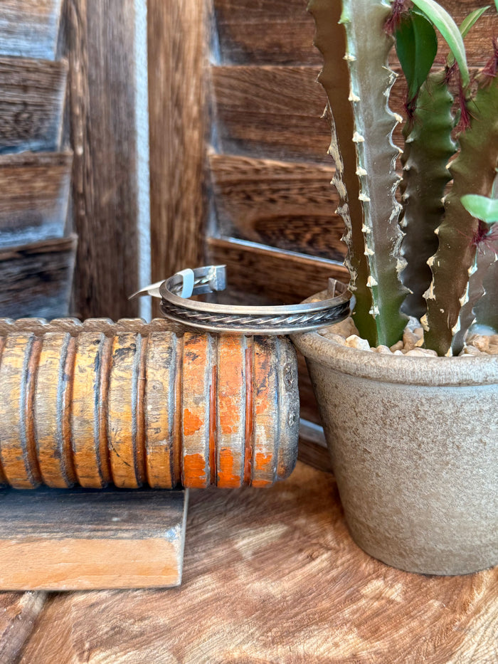 Silver native-style cuff bracelet with turquoise inlay, textured metal finish