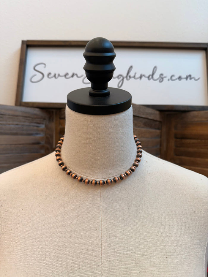 16-inch genuine copper bead necklace on mannequin bust
