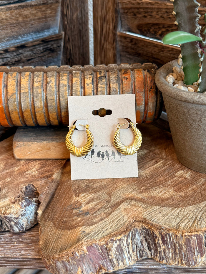 Textured gold-tone half hoop earrings, small rounded hoops with clasp, on card