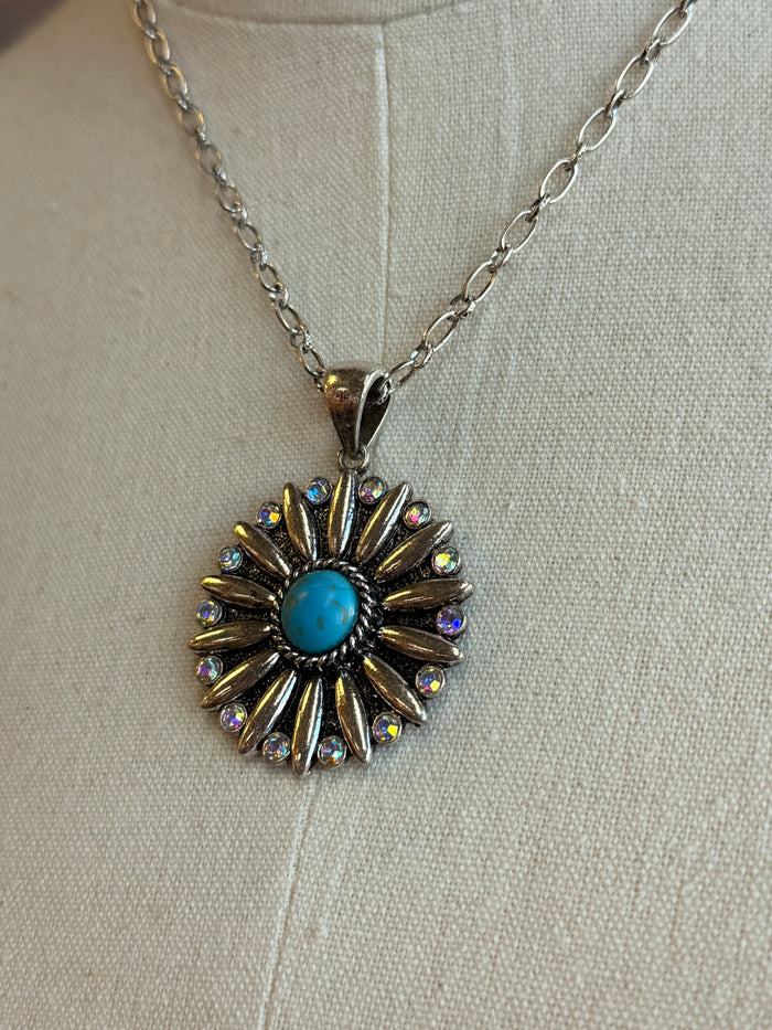 Turquoise crystal rosette pendant with multicolor rhinestone ray accents