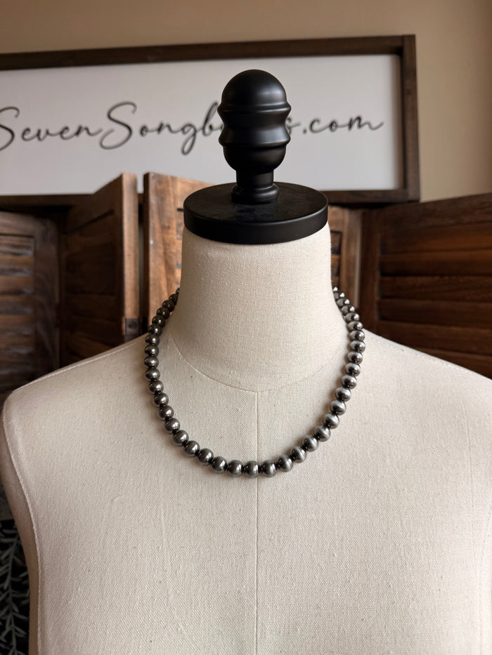 10mm silver pearl necklace on mannequin, 18-inch beaded strand