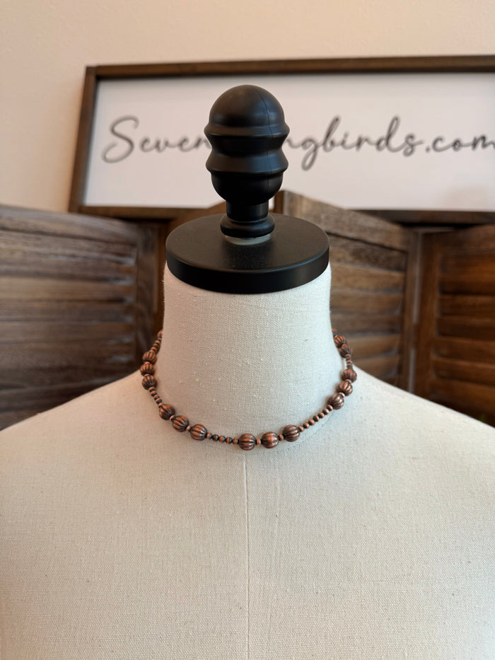 Copper beaded necklace with small pumpkin-shaped beads, 16 in length