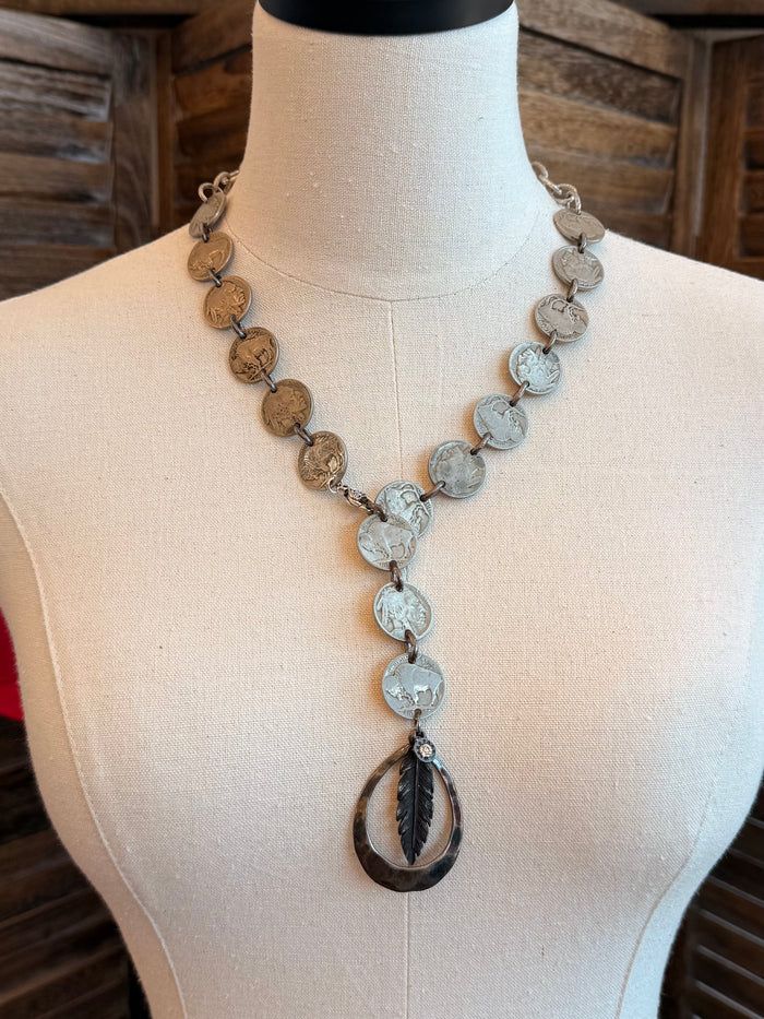 Feather pendant necklace with long coin chain charms in bronze and silver tones