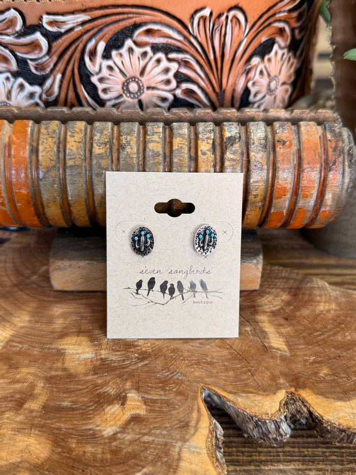 Turquoise oval stud earrings with black/silver bead border, silver-tone posts
