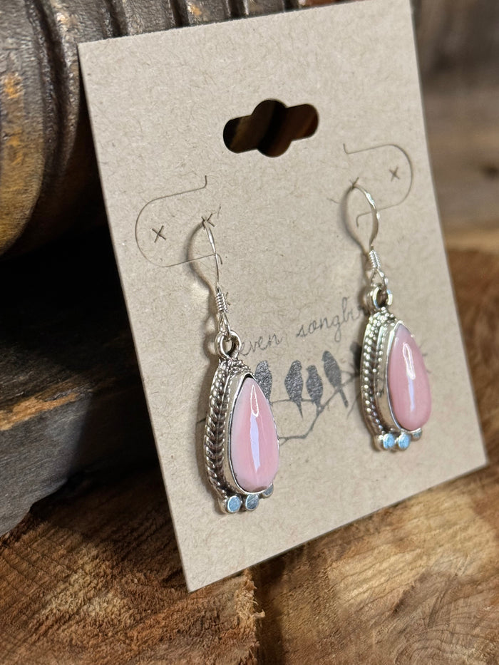 Pink teardrop fishhook earrings with silver oval frame and blue bead dangle