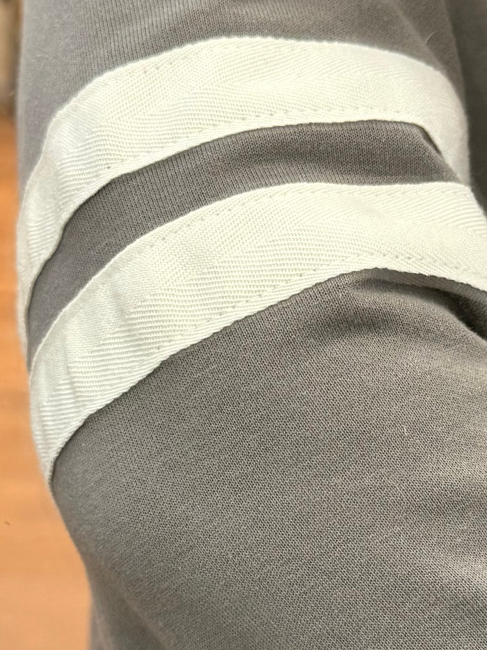 Gray sweatshirt sleeve with wide white varsity stripe