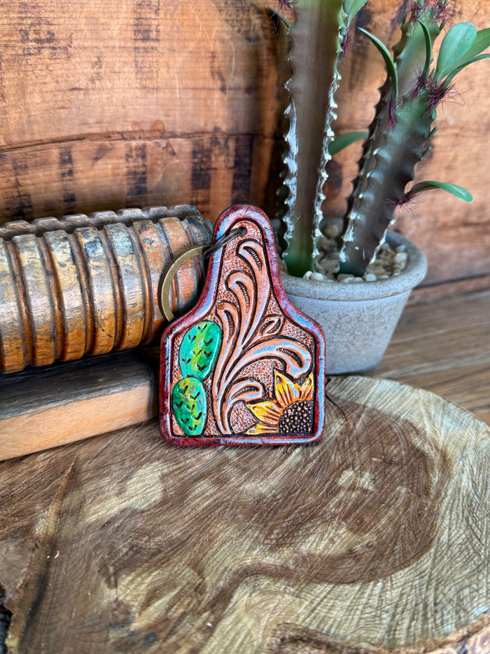 Cactus-shaped cowhide key fob with carved floral tooling, green inlay and metal ring