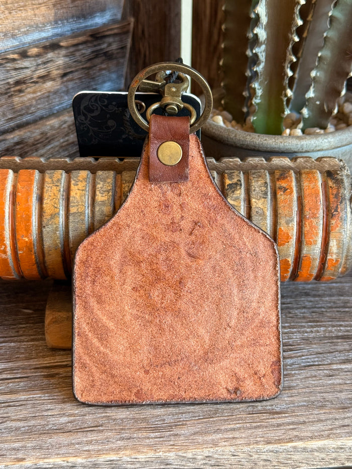 Brown suede leather keychain with brass eyelet and ring, blank front