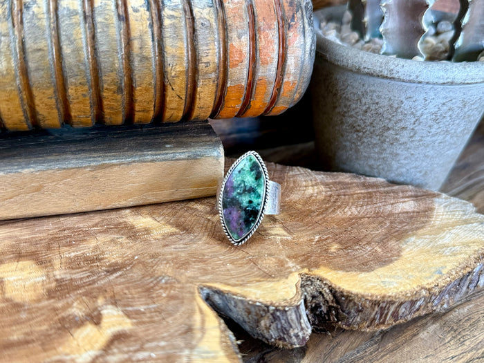 Oval turquoise-green stone adjustable ring with silver-toned bezel