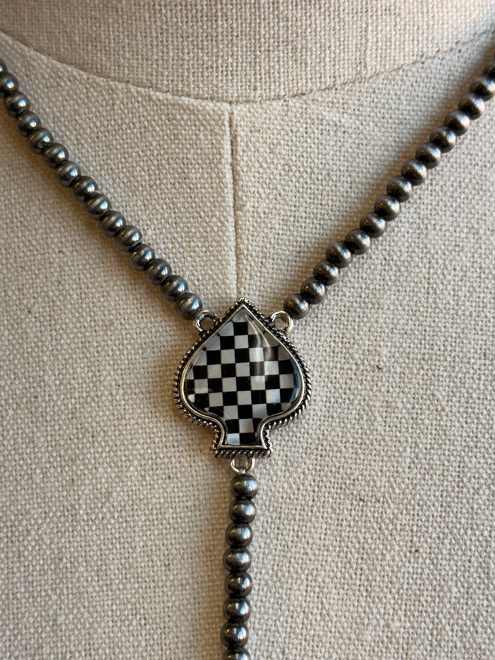 Checkered spade pendant on dark bead necklace chain, teardrop bail and sparkle detail