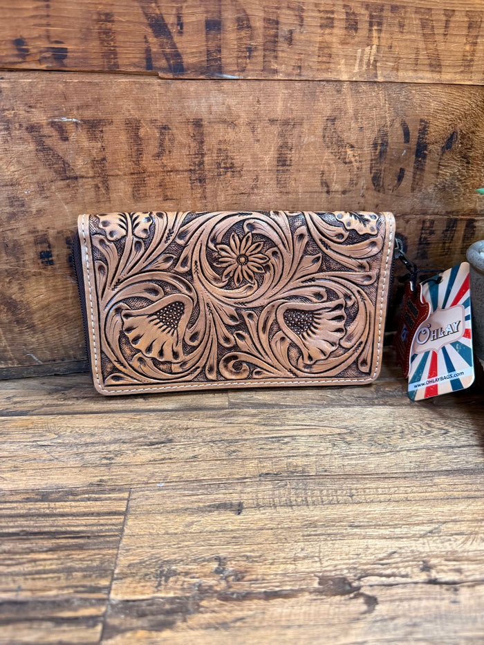 Tooled leather zip-around wallet with detailed floral and animal engraving on front