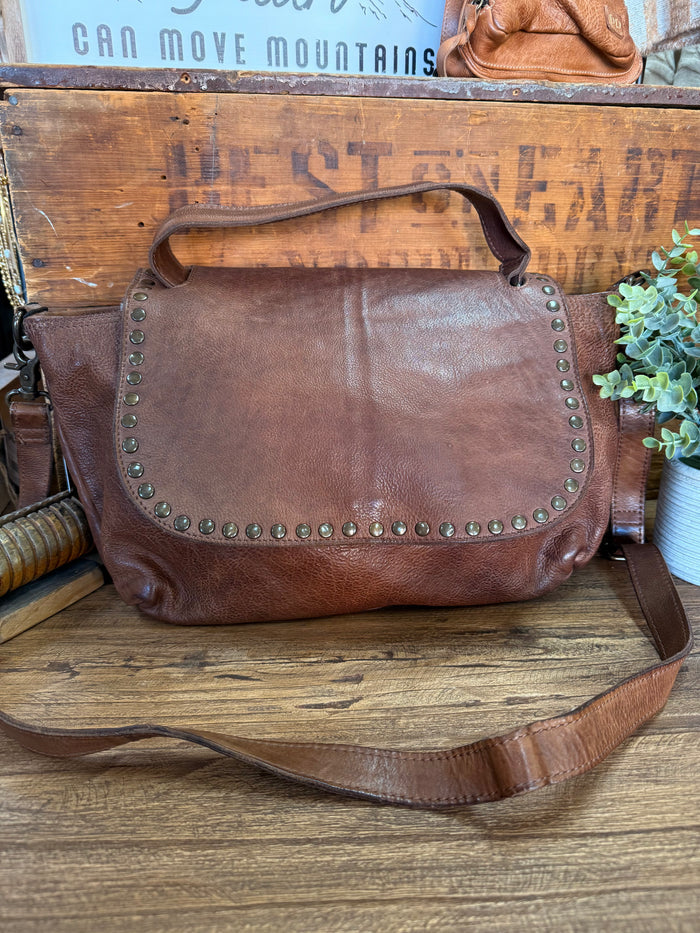 Chocolate leather flap crossbody purse with studded trim and adjustable shoulder strap