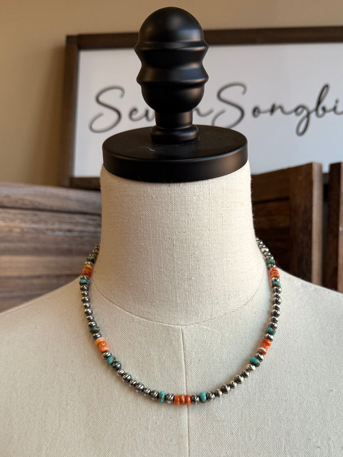 Beaded necklace with turquoise blue and orange spiny oyster accents and silver-tone links