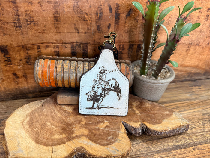 Bullrider hair-on key fob with white leather-look patch and bull rider graphic
