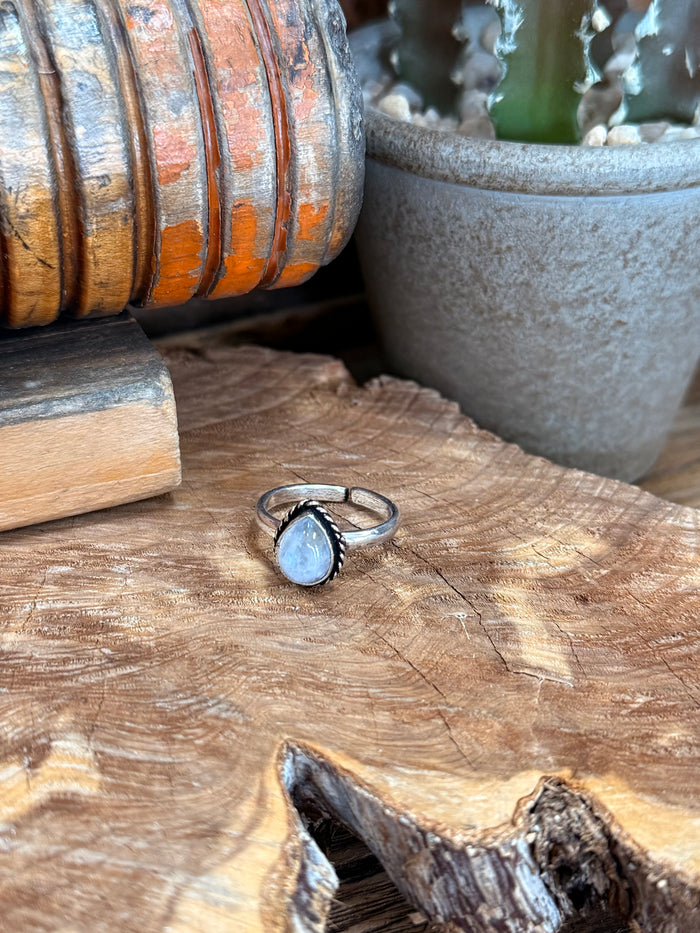 Silver-plated adjustable ring with oval light-blue stone bezel